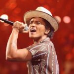 Bruno Mars performing I Just Might live during The Romantic era